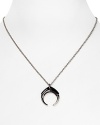 A gunmetal plated horn defines a simply styled silver link chain on a powerful Rebecca Minkoff pendant necklace.