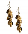 Add drops of elegance in rich earth tones. Kenneth Cole New York earrings feature a cluster of smoky topaz glass stones and metallic beads. Crafted in worn gold tone mixed metal. Approximate drop: 1-1/2 inches.