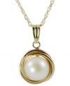 Nestled in quite nicely. This necklace, crafted from 14k gold, features a cultured freshwater pearl (7-8 mm) for an elegant touch. Approximate length: 18 inches. Approximate drop: 1 inch.