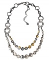 Twice as nice. Carolee's double-row statement necklace is sure to add an elegant effect to your wardrobe. Embellished with glittering glass beads, it's made in hematite tone mixed metal. Approximate length: 17 inches + 2-inch extender.