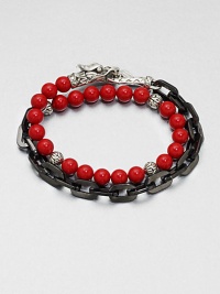This chain link and beaded, multi-row design of stainless steel and sterling silver is embellished with red coral for a colorful, charismatic touch.Stainless steel/sterling silverCoralAbout 3 diam.Imported