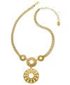 Glam it up like a golden goddess. T Tahari's sunshine-inspired pendant features a double circle drop in antique gold tone mixed metal. Base metal is nickel-free for sensitive skin. Approximate length: 18 inches + 3-inch extender. Approximate drop: 3-1/2 inches.