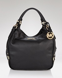 Dress up your day-to-day look with MICHAEL Michael Kors' rich leather tote. An ideal option for work, this roomy bag is chic set against classic tailoring and poised patent heels. Dress up your day-to-day look with MICHAEL Michael Kors' rich leather tote. An ideal option for work, this roomy bag is chic set against classic tailoring and poised patent heels.