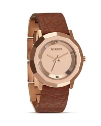 Favored for it's cool, sporty aesthetic, Nixon is the go to for watches with distinct style. This rose gold stainless steel and leather piece is a prime example with a modernist design and performance level durability. Favored for it's cool, sporty aesthetic, Nixon is the go to for watches with distinct style. This rose gold stainless steel and leather piece is a prime example with a modernist design and performance level durability.
