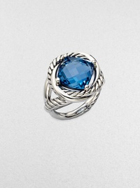 From the Infinity Collection. A richly colored, faceted blue topaz in a setting formed of intertwining smooth bands and cables of sterling silver.Blue topazSterling silverDiameter, about ½Imported