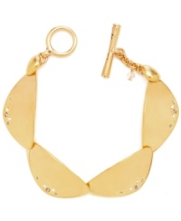 Divine golden discs. This gold-plated Kenneth Cole New York bracelet is composed of geometric gold-tone discs with pave crystal accents and a gold-tone toggle closure. Approximate length: 7-1/2 inches. Divine golden discs. This gold-plated Kenneth Cole New York bracelet is composed of geometric gold-tone discs with pave crystal accents and a gold-tone toggle closure. Approximate length: 7-1/2 inches.