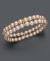 Elevate your look with shimmery pastels. This Charter Club bracelet features two rows of pink simulated plastic pearls crafted in mixed metal. Bracelet stretches to fit wrist. Approximate diameter: 3-1/2 inches.