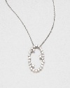 Sparkling white sapphires set in 14k white gold with a open oval design on a delicate link chain. White sapphire14k white goldLength, about 16Pendant size, about .6 Spring ring closureMade in USA
