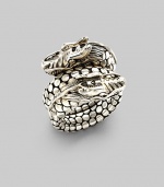 From the Naga Collection. A powerful dragon with dotted scales coils around the finger in this dramatic design. Sterling silver Width, about ¾ Made in Bali