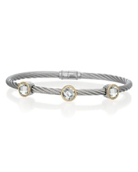 This striking 18K gold and stainless steel cable bracelet, studded with three glittering white topaz stations, is perfect for stacking. This striking 18K gold and stainless steel cable bracelet, studded with three glittering white topaz stations, is perfect for stacking.