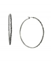 Put on the finishing touches. These traditional hoops feature a unique, textured surface in BCBGeneration's standout style. Crafted in oxidized silver tone mixed metal. Approximate diameter: 2-1/2 inches.