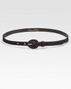 This slender belt is covered in luxurious silk faille.About ½ wideSilkMade in USA