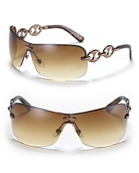 Oversized, metal rimmed, shield sunglasses with chain link temple detail. Logo at center front. Adjustable nose pads for secure comfort. Oversized, metal rimmed, shield sunglasses with chain link temple detail. Logo at center front. Adjustable nose pads for secure comfort.