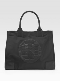 The classic nylon tote gets a signature touch from Tory's iconic logo in leather trim.Double leather top handles, 7 drop Magnetic snap closure One inside zip pocket Two inside open pockets Nylon lining 16½W X 13½H X 5½D Imported The classic nylon tote gets a signature touch from Tory's iconic logo in leather trim.Double leather top handles, 7 drop Magnetic snap closure One inside zip pocket Two inside open pockets Nylon lining 16½W X 13½H X 5½D Imported