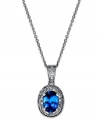 True shine. Indulge in this sophisticate piece featuring an oval-cut tanzine (3/4 ct. t.w.) surrounded by sparkling diamond accents. Necklace set in sterling silver. Approximate length: 18 inches. Approximate drop: 5/8 inch.