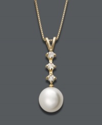 Let elegance define you. Belle de Mer necklace features a cultured freshwater pearl (8-9 mm) highlighted by three, round-cut diamonds (1/8 ct. t.w.). Setting and chain crafted in 14k gold. Approximate length: 18 inches. Approximate drop: 3/4 inch. Let elegance define you. Belle de Mer necklace features a cultured freshwater pearl (8-9 mm) highlighted by three, round-cut diamonds (1/8 ct. t.w.). Setting and chain crafted in 14k gold. Approximate length: 18 inches. Approximate drop: 3/4 inch.