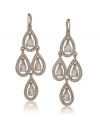 Carolee's glittering pave chandelier earrings are a glamorous finishing touch for your evening look. Crafted with glass crystals in gold tone mixed metal. Approximate drop: 3 inches.