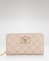 Pull off the posh, pretty, and practical look with this leather wallet from Marc Jacobs. Crafted from quilted leather and accented with the brand's signature hardware, it's an essential no fashion girl should be without.