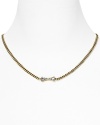 Pretty with a punkish edge. Tie on MARC BY MARC JACOBS' signature style with this bow-bedecked necklace.