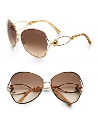 This curvy, gold-tone style boasts a thin metal frame with eye-catching semiprecious stones and logo-engraved lens. Available in rose gold with brown gradient lens.Strass and semiprecious stone temples100% UV protectionMade in Italy This curvy, gold-tone style boasts a thin metal frame with eye-catching semiprecious stones and logo-engraved lens. Available in rose gold with brown gradient lens.Strass and semiprecious stone temples100% UV protectionMade in Italy