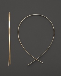 An inverted hoop earring in 14 Kt. gold, with thread-through closure. Designed by Lana. An inverted hoop earring in 14 Kt. gold, with thread-through closure. Designed by Lana.