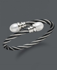 Wrap your wrists in polished perfection. This coil-shaped bangle bracelet features white cultured freshwater pearls (10-11 mm) set in twisted stainless steel. Approximate length: 8 inches. Wrap your wrists in polished perfection. This coil-shaped bangle bracelet features white cultured freshwater pearls (10-11 mm) set in twisted stainless steel. Approximate length: 8 inches.