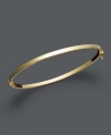 A simple luxury when worn solo, a must-have trend when stacked with others. Bangle features a tube shape crafted in 14k gold. Approximate diameter: 2-3/8 inches.