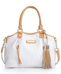 An elegant design with just the right amount of carefree detailing. This Calvin Klein shopper features shiny goldtone hardware, chain embellished straps and fun tassel accents. An elegant design with just the right amount of carefree detailing. This Calvin Klein shopper features shiny goldtone hardware, chain embellished straps and fun tassel accents.