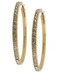 Go big this season. T Tahari blends golden tones with shimmering crystal studs on these large hoop earrings. Crafted in gold tone mixed metal. Base metal is nickel-free for sensitive skin. Approximate diameter: 1-1/4 inch. Go big this season. T Tahari blends golden tones with shimmering crystal studs on these large hoop earrings. Crafted in gold tone mixed metal. Base metal is nickel-free for sensitive skin. Approximate diameter: 1-1/4 inch.