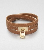 This effortless style features a chic logo accented padlock charm on a supple wrapped leather strip. LeatherGoldtone brassLength, about 25Buckle closureImported 