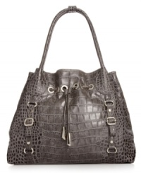 Every urban-jungle ensemble deserves exotic appeal, like this croc-embossed tote from Jessica Simpson. The spacious design is outfitted with gleaming hardware and buckle accents, while the interior flaunts multiple pockets for effortless on-the-go style. Every urban-jungle ensemble deserves exotic appeal, like this croc-embossed tote from Jessica Simpson. The spacious design is outfitted with gleaming hardware and buckle accents, while the interior flaunts multiple pockets for effortless on-the-go style.