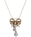 A vintage-inspired style your grandmother would love. This pendant necklace from Betsey Johnson features a bow encrusted with crystal accents, a crystal teardrop, crystal fireball and silver tone bubble heart. Crafted in antiqued gold tone mixed metal. Approximate length: 16 inches + 3-inch extender. Approximate drop: 2 inches.