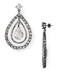 Juicy Couture arranges glassy crystals in orbital teardrops to create punk-chic post earrings, crafted of silver plated metal.