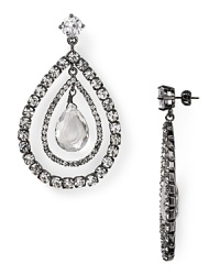 Juicy Couture arranges glassy crystals in orbital teardrops to create punk-chic post earrings, crafted of silver plated metal. Juicy Couture arranges glassy crystals in orbital teardrops to create punk-chic post earrings, crafted of silver plated metal.