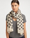 Spotted like a dalmatian, this ultra-soft, wool-blend wrap features a bold polka dot design and logo detail.Wool53 X 70Dry cleanImported