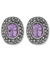 Perfect your look with polished studs. Genevieve & Grace's oval-shaped earrings feature amethyst centers (3-5/8 ct. t.w.) surrounded by glittering marcasite. Set in sterling silver. Earrings feature an omega clip-on backing for non-pierced ears. Approximate length: 3/4 inch. Approximate width: 5/8 inch.