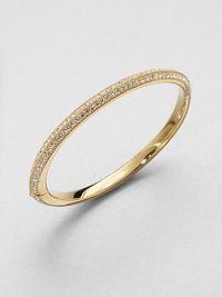 A sparkling, 18k goldplated piece with pavé crystals; perfect for stacking or on it's own. Crystals18k goldplatedDiameter, about 2.25Hinged, box and tongue closureImported A sparkling, 18k goldplated piece with pavé crystals; perfect for stacking or on it's own. Crystals18k goldplatedDiameter, about 2.25Hinged, box and tongue closureImported