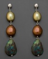 Exotic beauty. These drop earrings feature turquoise and off-shape baroque cultured freshwater pearl backed in sterling silver.  Approximate drop: 1-1/2 inches.