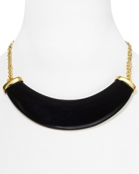 A bold polished resin horn punctuates this Kenneth Jay Lane necklace, which lends a fashion-forward feel to a simply styled 22-karat gold plated chain. A bold polished resin horn punctuates this Kenneth Jay Lane necklace, which lends a fashion-forward feel to a simply styled 22-karat gold plated chain.