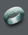 Symbolic for serenity with a pale color palette, this unique bangle bracelet features a carved design in solid jade (30 mm). Approximate diameter: 3 inches.