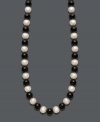 Show your true stripes with stylish, contrasting colors. Necklace features a chic strand of bold onyx beads (85 ct. t.w.) and cultured freshwater pearls (8-9 mm). Clasp crafted in 14k gold. Approximate length: 18 inches.