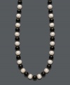 Show your true stripes with stylish, contrasting colors. Necklace features a chic strand of bold onyx beads (85 ct. t.w.) and cultured freshwater pearls (8-9 mm). Clasp crafted in 14k gold. Approximate length: 18 inches.