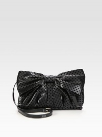 A feminine design of dotted velor on faux leather, topped off with a front bow and shiny patent leather strap. Adjustable patent leather shoulder strap, 23½-25 dropMagnetic flap closureOne inside zip pocketCotton lining11½W X 7½H X 1½DMade in Italy A feminine design of dotted velor on faux leather, topped off with a front bow and shiny patent leather strap. Adjustable patent leather shoulder strap, 23½-25 dropMagnetic flap closureOne inside zip pocketCotton lining11½W X 7½H X 1½DMade in Italy