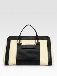 An ultra-roomy carryall in a luxurious leather colorblock design.Double top handles, 4½ dropTop zip closureTwo outside open pocketsOne inside zip pocketTwo inside open pocketsCotton lining16½W X 13H X 10DMade in Italy An ultra-roomy carryall in a luxurious leather colorblock design.Double top handles, 4½ dropTop zip closureTwo outside open pocketsOne inside zip pocketTwo inside open pocketsCotton lining16½W X 13H X 10DMade in Italy