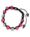 Spiritual-inspired bracelets are all the rage this season! Snap up this hot style from Ali Khan featuring semi-precious fuchsia jade beads and pave glass fireballs on a trendy black cord. Bracelet adjusts to fit the wrist. Approximate diameter: 2 inches. Approximate length: 12-1/4 inches.