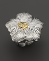 A delicate gardenia, captured at the heights of its beauty in sterling silver and 18K yellow gold, blooms on this ring from Buccellati.