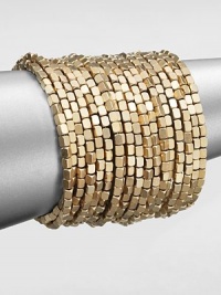 Satin finished, goldtone beading makes a dramatic statement in this coil wrap design.Brass Diameter, about 2½ Imported Satin finished, goldtone beading makes a dramatic statement in this coil wrap design.Brass Diameter, about 2½ Imported