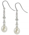 Sleek and sophisticated, this pair of sterling silver earrings dazzles with cultured freshwater pearls (9-9-1/2 mm) offset by rhodium-plated sparkle beads for a lustrous touch. Approximate drop: 1-7/8 inches.