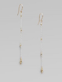 Gracefully dangling strands of sterling silver chain, sprinkled and tipped with glowing faceted beads of 14k gold.14k yellow gold and sterling silverLength, about 2¼Ear wireMade in USA Gracefully dangling strands of sterling silver chain, sprinkled and tipped with glowing faceted beads of 14k gold.14k yellow gold and sterling silverLength, about 2¼Ear wireMade in USA
