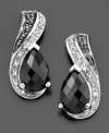 Add a touch of fabulous to your look with these stylish earrings featuring onyx (9 by 6 mm) and round-cut diamonds (1/10 ct. t.w.) set in sterling silver. Approximate drop: 3/4 inches.